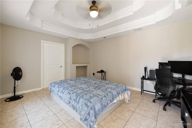 bedroom featuring light tile patterned floors, a raised ceiling, visible vents, and baseboards