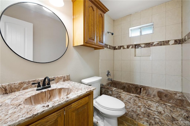 bathroom with toilet, shower / bathtub combination, and vanity