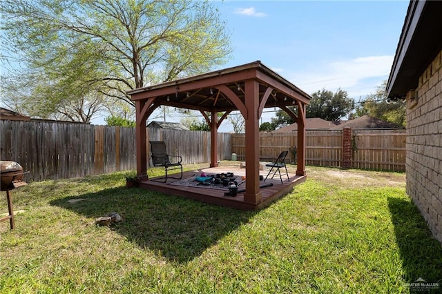 view of yard with a gazebo and a fenced backyard