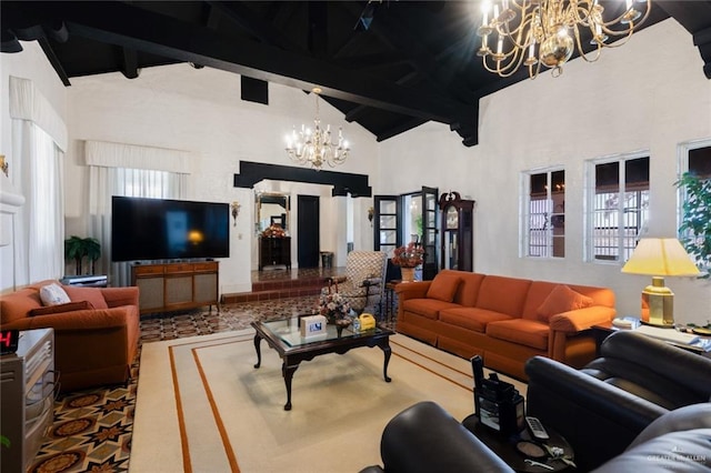 living room featuring beamed ceiling, high vaulted ceiling, and an inviting chandelier