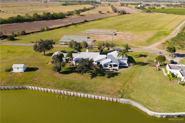 aerial view with a rural view and a water view