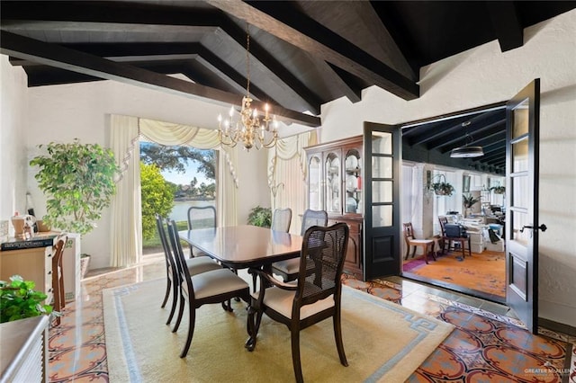 dining space featuring french doors, vaulted ceiling with beams, and a notable chandelier