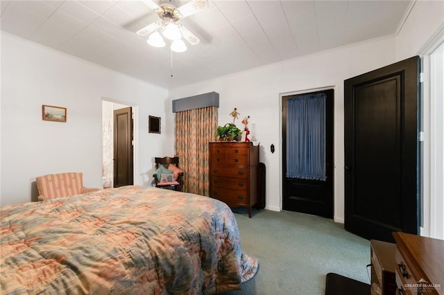 bedroom with carpet flooring, ceiling fan, and crown molding