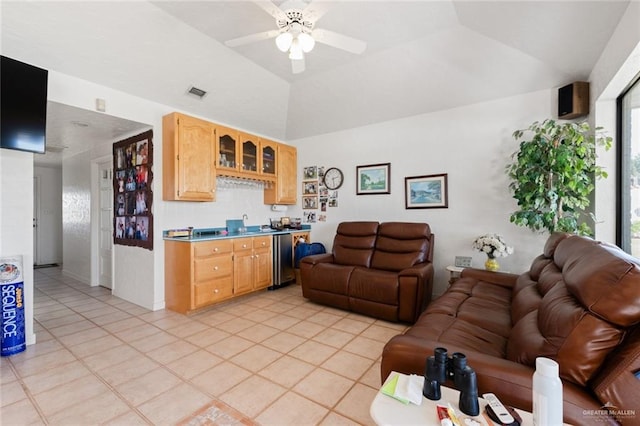 living room featuring ceiling fan and light tile patterned flooring