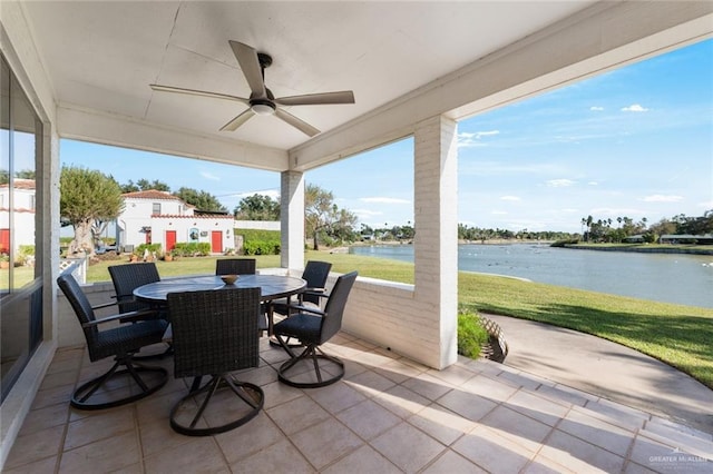 view of patio / terrace featuring a water view and ceiling fan