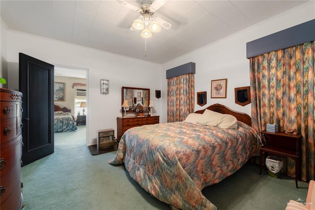 bedroom featuring ceiling fan, carpet, and ornamental molding