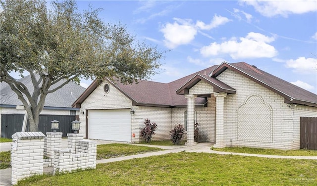 view of front facade featuring a garage and a front lawn