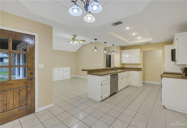 kitchen featuring kitchen peninsula, appliances with stainless steel finishes, sink, white cabinets, and hanging light fixtures