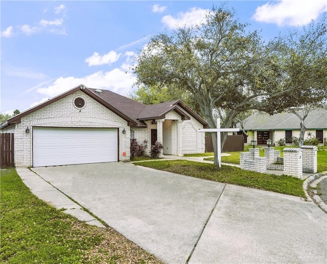 ranch-style house with a front yard and a garage