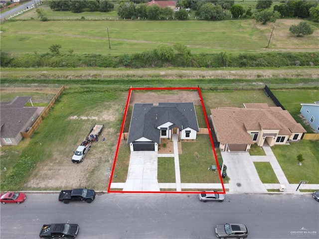 birds eye view of property featuring a rural view