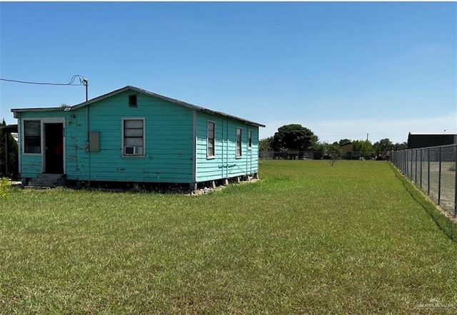 view of side of property with a yard