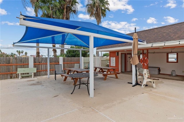 view of patio / terrace featuring fence