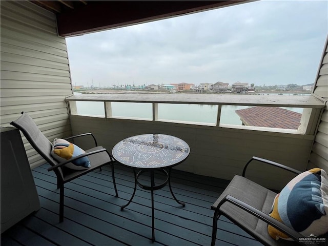 balcony featuring a water view