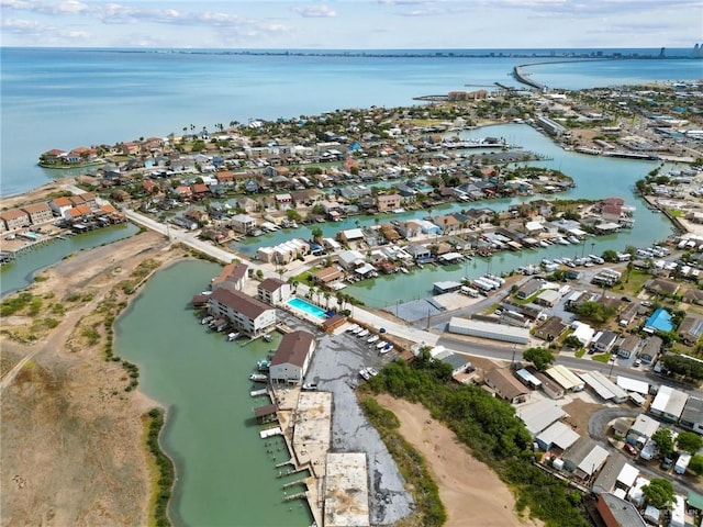 drone / aerial view featuring a residential view and a water view