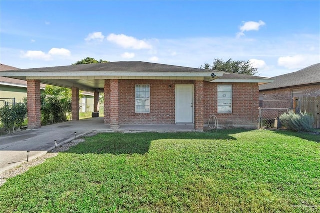 single story home with a carport and a front lawn