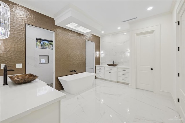 3910 La Hacienda St, Weslaco, TX 78596 - full bath featuring ornamental molding, marble finish floor, two vanities, and a sink