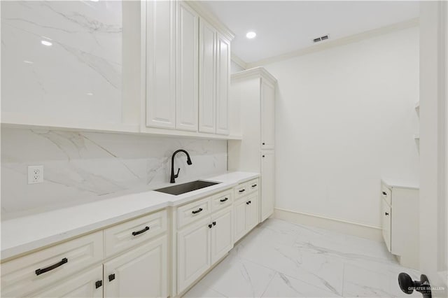 3910 La Hacienda St, Weslaco, TX 78596 - kitchen with a sink, light countertops, marble finish floor, and visible vents