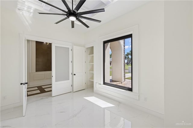 3910 La Hacienda St, Weslaco, TX 78596 - unfurnished room with baseboards, marble finish floor, and ceiling fan