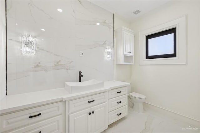 3910 La Hacienda St, Weslaco, TX 78596 - bathroom featuring toilet, marble finish floor, ornamental molding, visible vents, and vanity