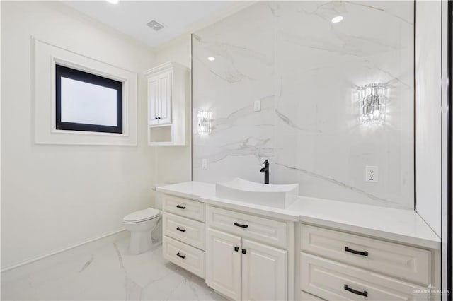 3910 La Hacienda St, Weslaco, TX 78596 - bathroom with toilet, marble finish floor, visible vents, vanity, and crown molding
