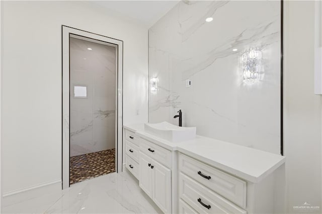 3910 La Hacienda St, Weslaco, TX 78596 - bathroom featuring a marble finish shower, marble finish floor, and vanity