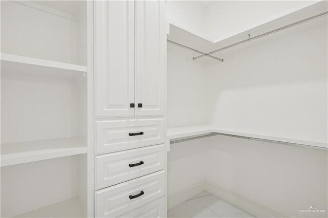 3910 La Hacienda St, Weslaco, TX 78596 - walk in closet featuring marble finish floor