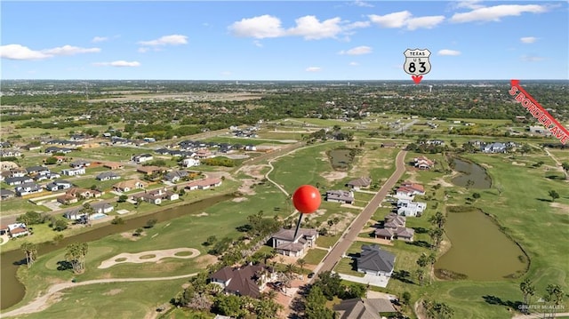 3910 La Hacienda St, Weslaco, TX 78596 - aerial view with a water view, golf course view, and a residential view