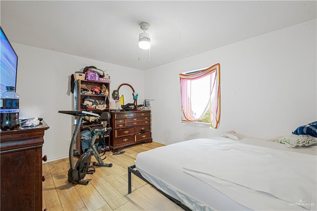 bedroom featuring ceiling fan and light hardwood / wood-style floors