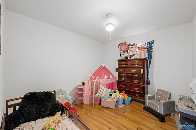 bedroom featuring hardwood / wood-style floors