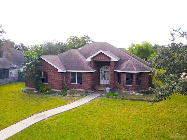 ranch-style home with a front lawn