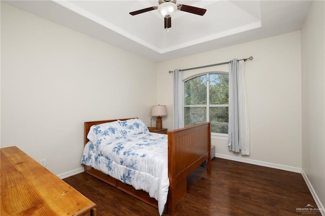 622 Comedy Ln, Edinburg, TX 78542 - bedroom with a raised ceiling, wood finished floors, baseboards, and ceiling fan