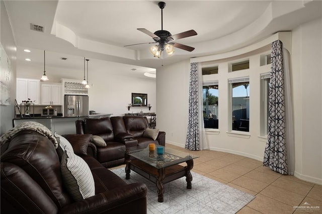 622 Comedy Ln, Edinburg, TX 78542 - living room featuring a tray ceiling, ceiling fan, light tile patterned flooring, baseboards, and recessed lighting