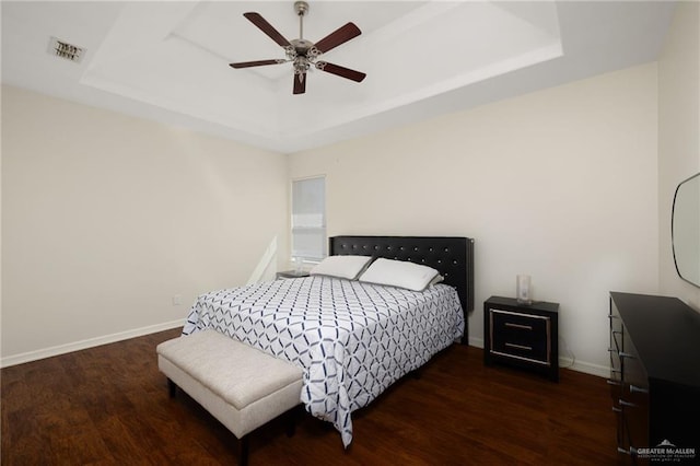 622 Comedy Ln, Edinburg, TX 78542 - bedroom with a tray ceiling, wood finished floors, and baseboards