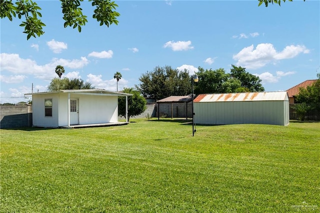 622 Comedy Ln, Edinburg, TX 78542 - view of yard featuring an outdoor structure and an outbuilding