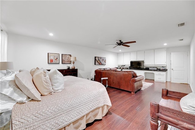 bedroom with ceiling fan and dark wood-type flooring