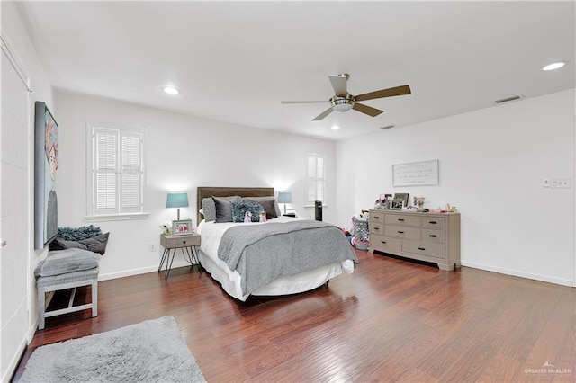 bedroom featuring dark hardwood / wood-style floors and ceiling fan