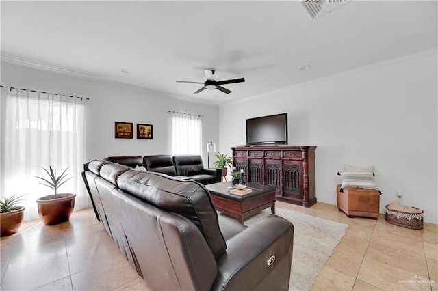 living room with ceiling fan, ornamental molding, and light tile patterned flooring