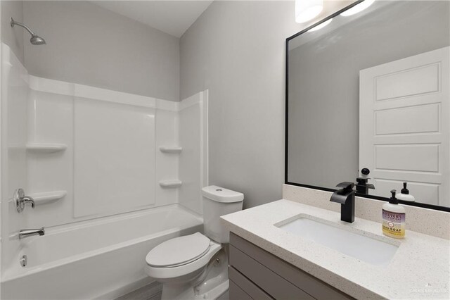 323 Uva Ln, Brownsville, TX 78521 - bathroom featuring toilet, vanity, and shower / bathtub combination