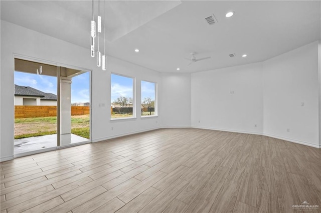 spare room with visible vents, baseboards, ceiling fan, wood finished floors, and recessed lighting