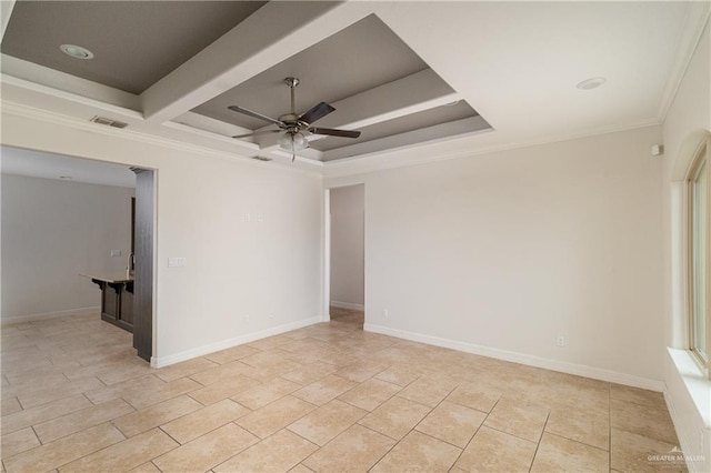 tiled spare room with beamed ceiling, ceiling fan, a raised ceiling, and crown molding