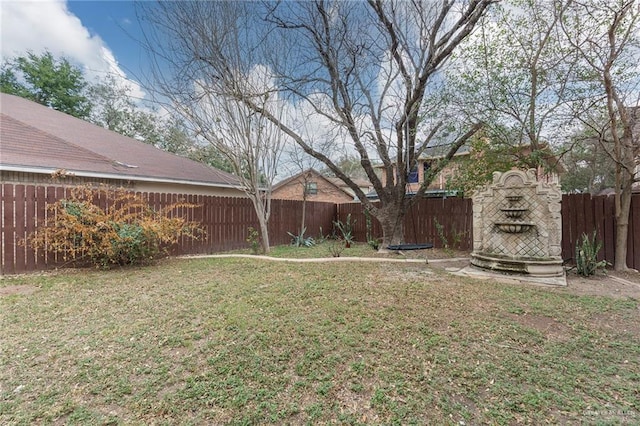 view of yard with an outdoor fireplace