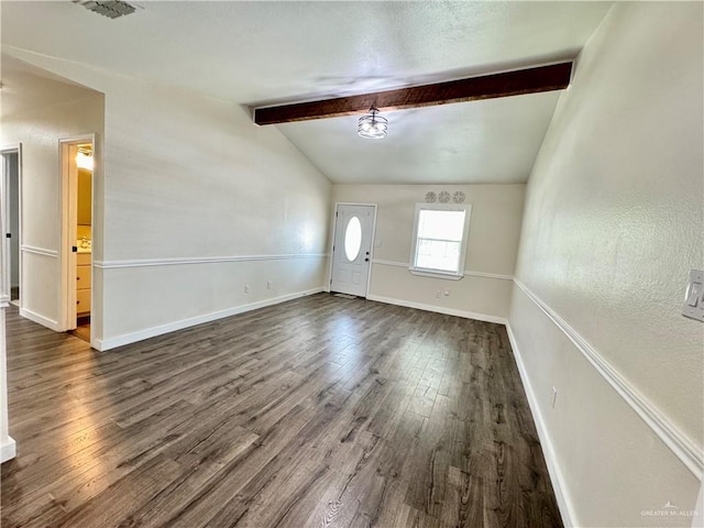 foyer with vaulted ceiling with beams, dark wood finished floors, visible vents, and baseboards