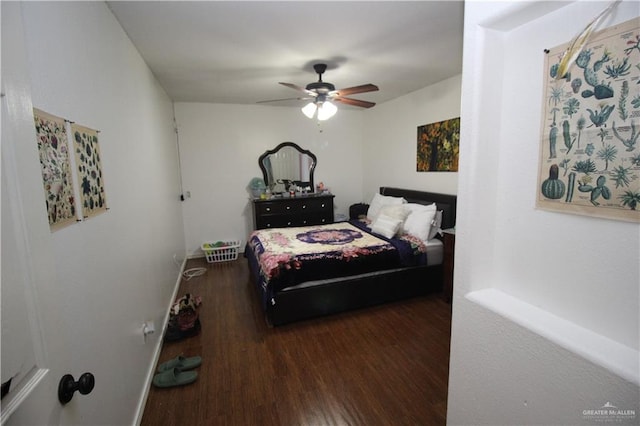 bedroom featuring ceiling fan and dark hardwood / wood-style flooring