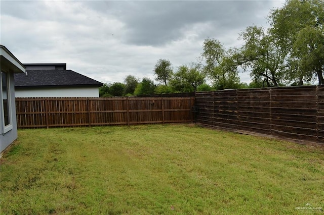 view of yard featuring a fenced backyard