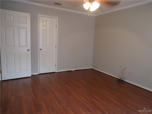 unfurnished bedroom featuring ceiling fan, dark wood-type flooring, and ornamental molding