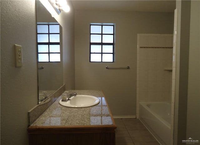 bathroom with tile patterned flooring and vanity