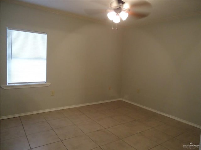 tiled spare room featuring ceiling fan