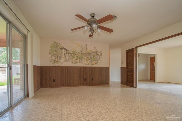 300 W Westway Ave, Mcallen, TX 78501 - empty room featuring a wainscoted wall, a ceiling fan, and light flooring