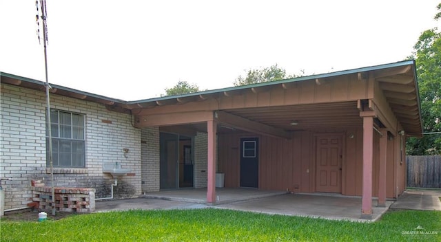 300 W Westway Ave, Mcallen, TX 78501 - rear view of property with brick siding, a patio, and board and batten siding