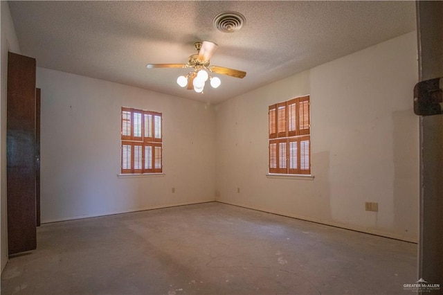300 W Westway Ave, Mcallen, TX 78501 - empty room with unfinished concrete floors, a ceiling fan, and a textured ceiling